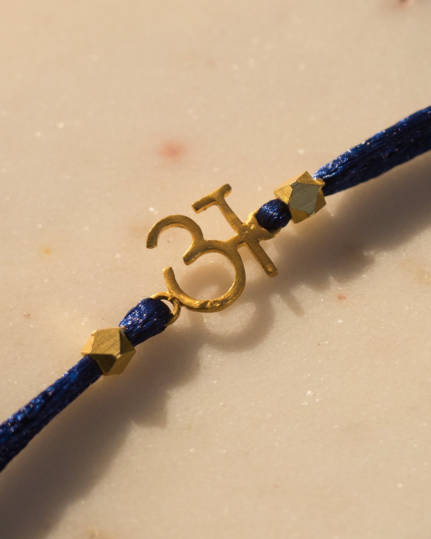 Alphabet A Rakhi - Gold