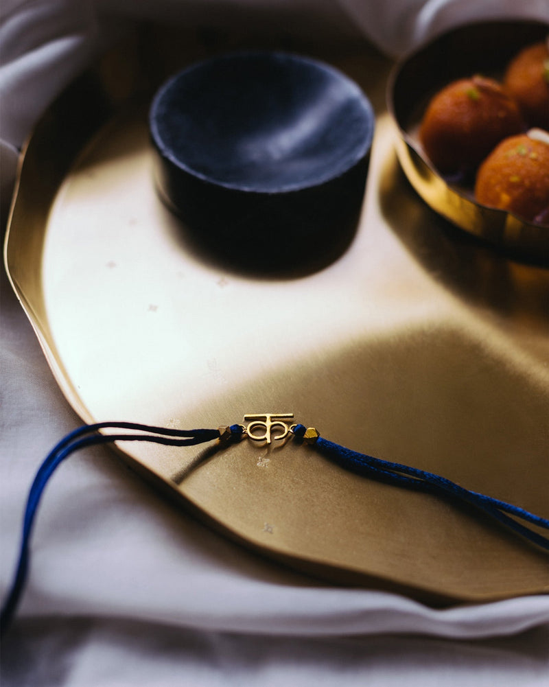 Alphabet K Rakhi - Gold