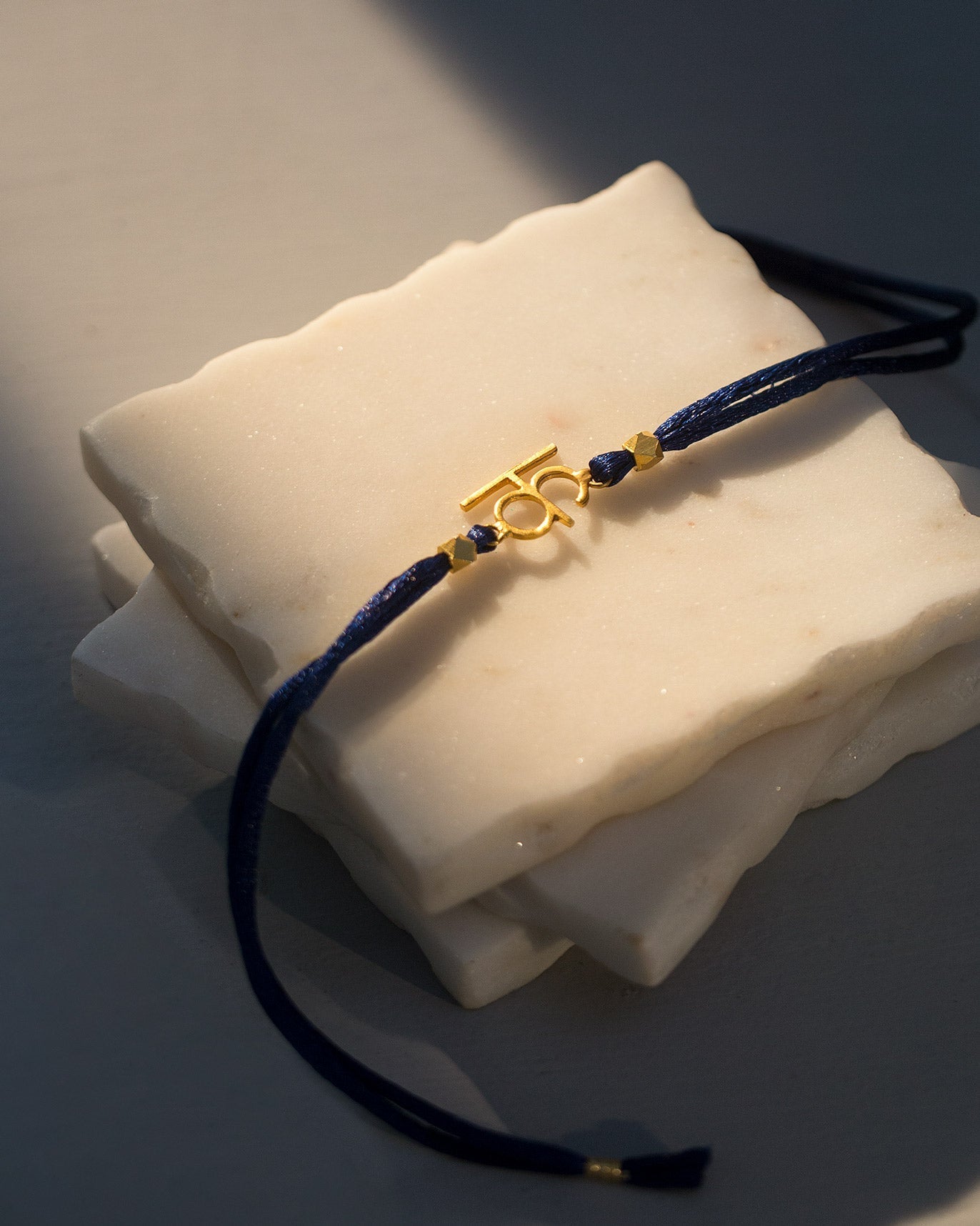 Alphabet K Rakhi - Gold