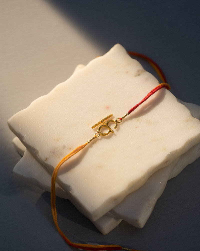 Alphabet K Rakhi - Saffron