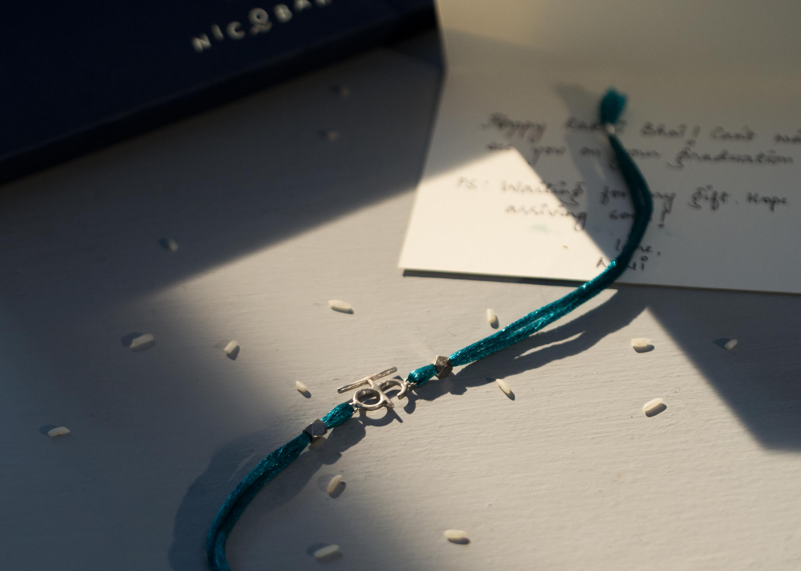 Alphabet K Rakhi - Silver