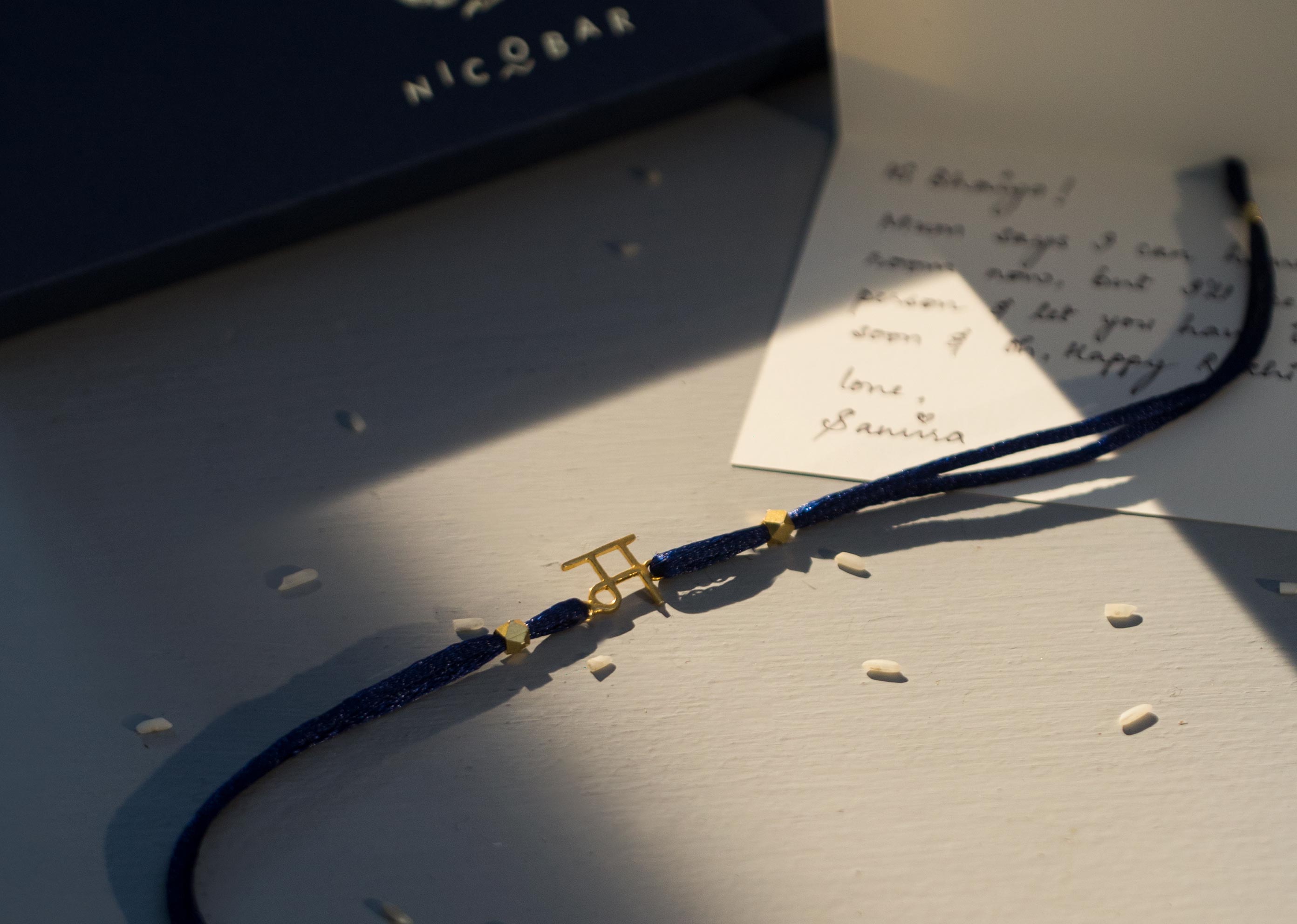 Alphabet M Rakhi - Gold