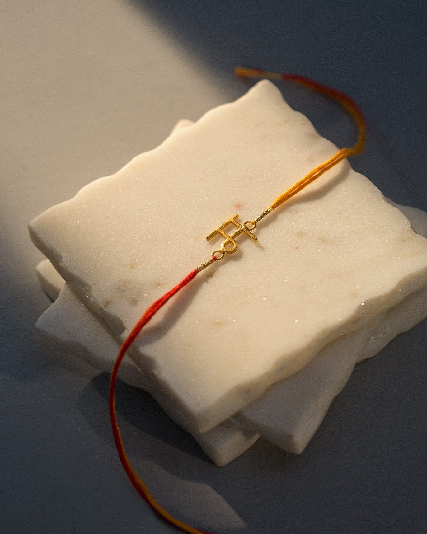 Alphabet M Rakhi - Saffron