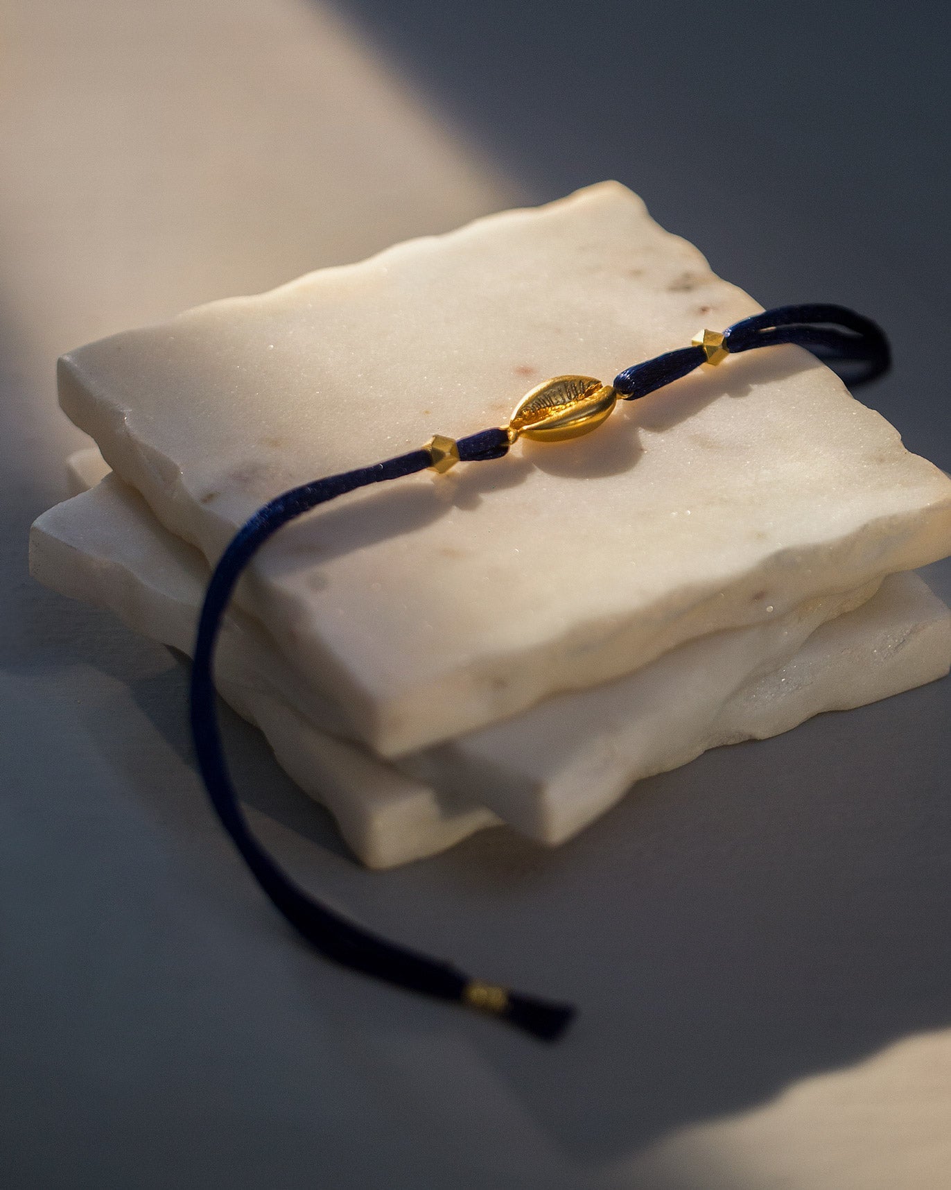 Cowri Rakhi - Gold