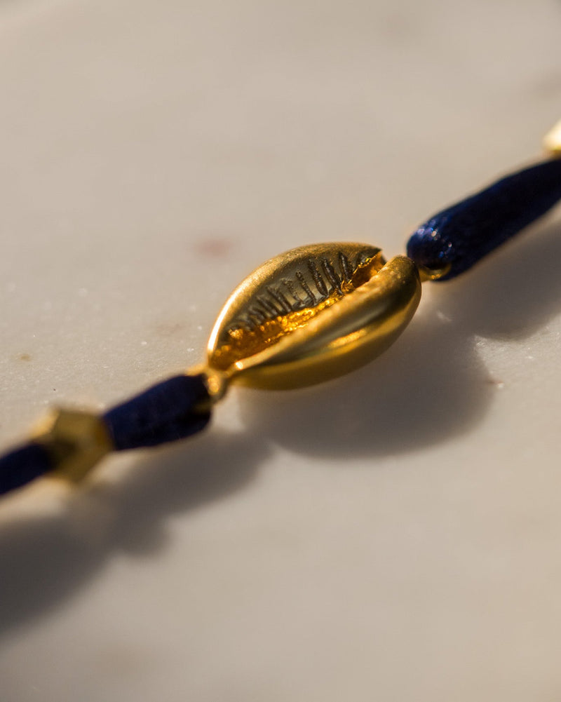 Cowri Rakhi - Gold