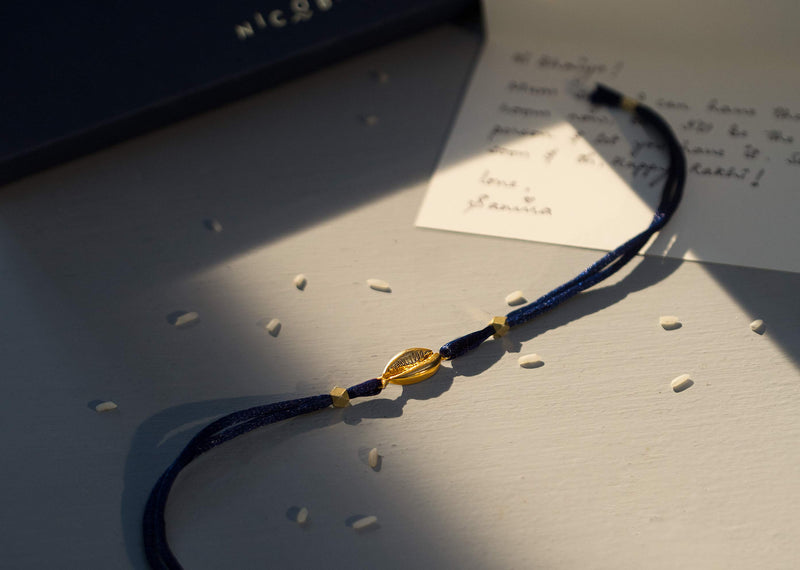 Cowri Rakhi - Gold