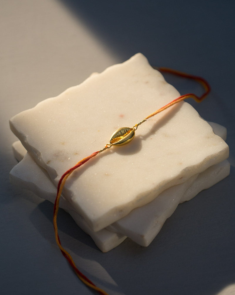 Cowri Rakhi - Saffron