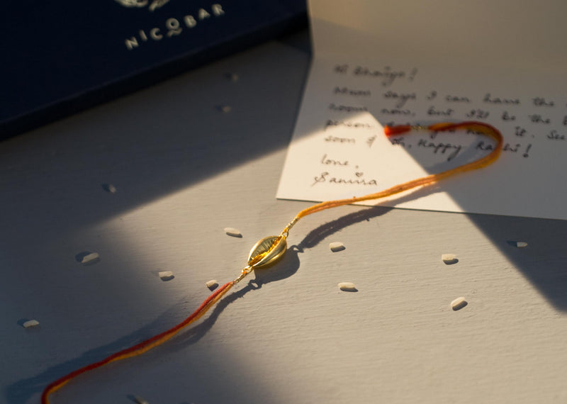 Cowri Rakhi - Saffron