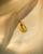 Cowri shell charm